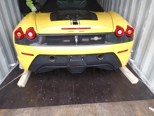 Vehicle secured inside a container